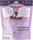 The image shows a 200g package of Island of Pets Air-dried Dental Cubes in Atlantic Redfish flavor. The packaging features a cartoon dog in a boat, with colorful graphics and text highlighting the product’s benefits for dental health.