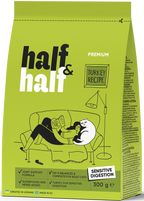 A green bag of Half&Half cat food featuring a turkey recipe, labeled for sensitive digestion. The design shows a person lounging on a couch with a cat, emphasizing comfort and companionship.